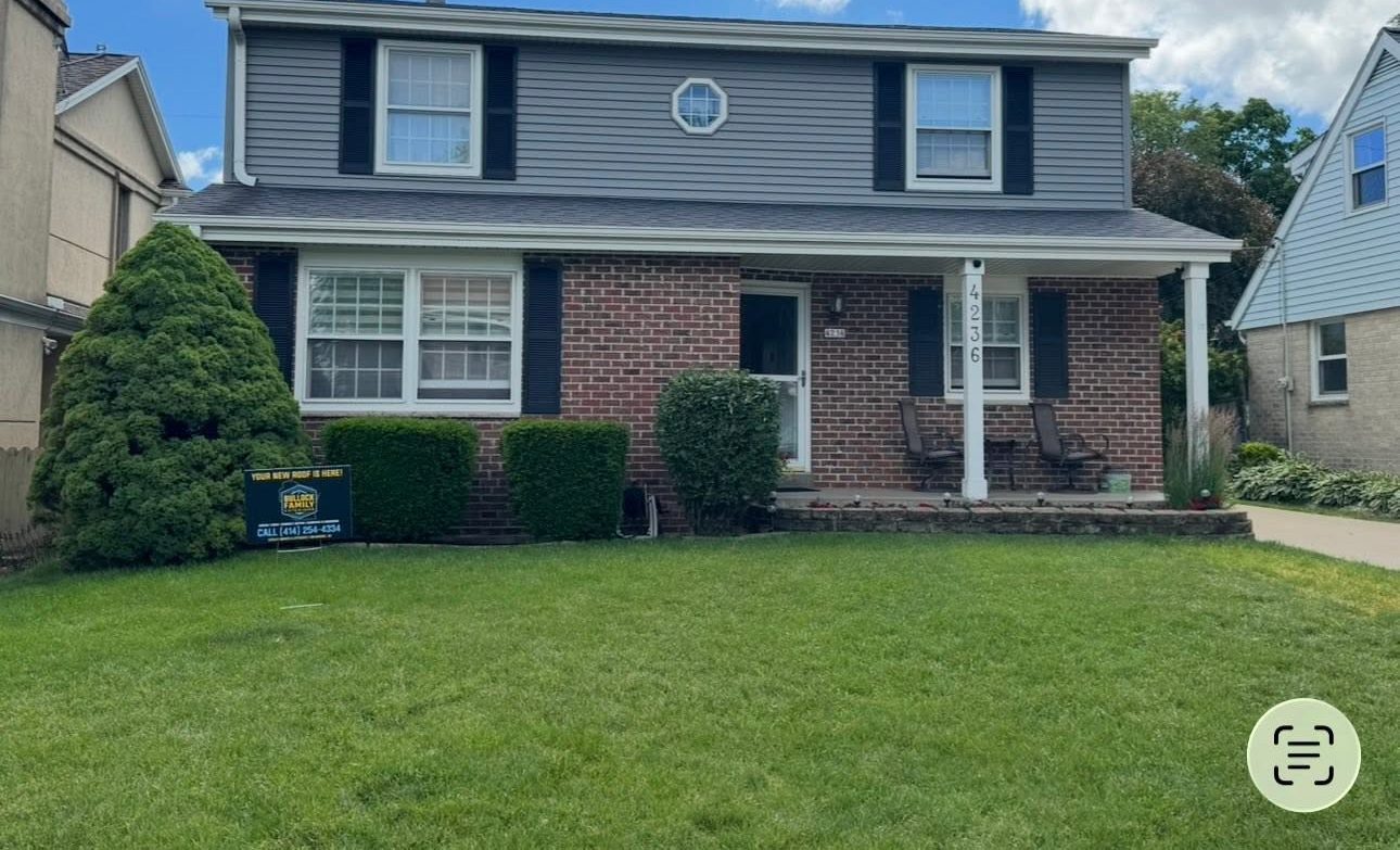 Same home with new gray siding after TrueNorth Exteriors