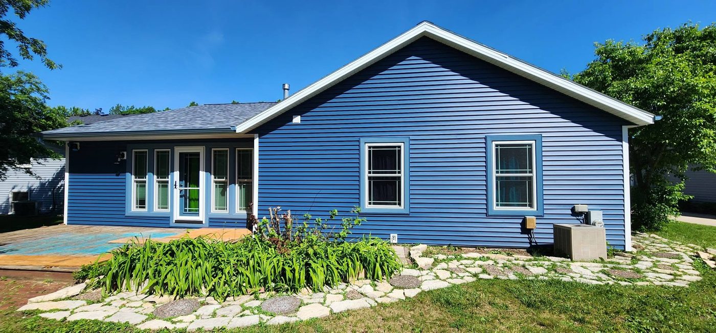 Same home with fresh blue siding after TrueNorth Exteriors